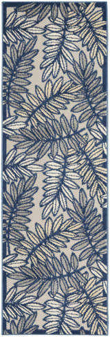 Close-up of the Nourison Aloha Ivory Navy Tropical Area Rug featuring a leaf pattern in navy, ivory, and gray.