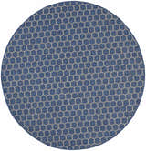 Close-up of a round Nourison Twist Reversible Blue rug with a modern geometric honeycomb pattern.