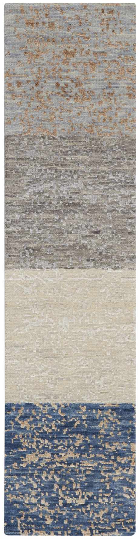 Close-up of the handmade Nourison Luna Dark Blue Mocha rug, featuring blue, mocha, ivory, and gray tones.
