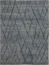 Close-up of the handmade Nourison OCEAN Indigo Area Rug, featuring a modern geometric pattern and purple hues.