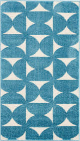 Close-up of Nourison Harper Blue Colorful Indoor Area Rug with a geometric circle and triangle pattern.