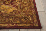 Close-up of the multicolor Nourison Jaipur Persian rug showing wool texture and floral pattern in red, gold, and green.