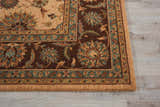 Close up of Nourison Living Treasures Beige rug showing floral pattern, brown border, and teal accents.