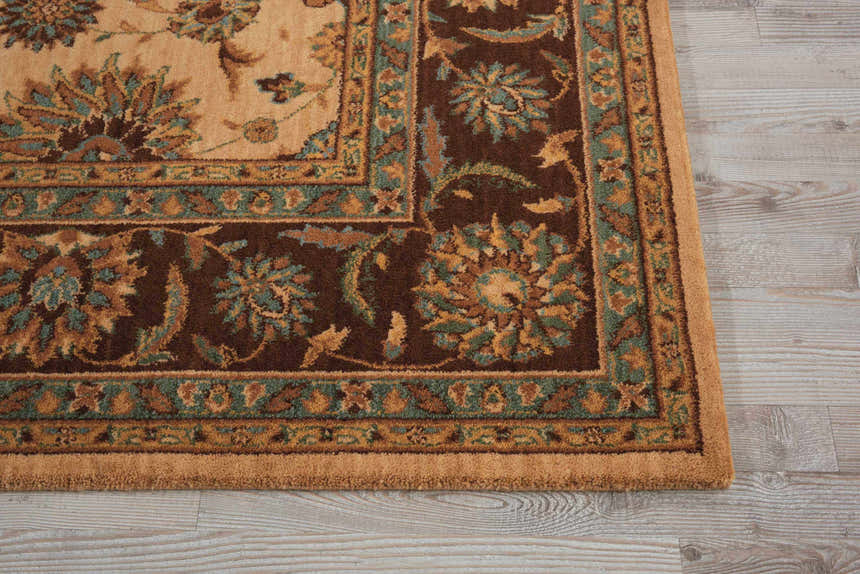 Close up of Nourison Living Treasures Beige rug showing floral pattern, brown border, and teal accents.