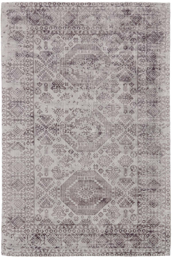 Close-up of Feizy Nadia rug. Gray and purple viscose rug with a traditional bordered, vintage design. Hand woven rectangle shape. Design-Rectangle