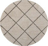 Close-up of a round Nourison Brisbane Cream Shag Indoor Area Rug with a geometric diamond pattern. Cream color.