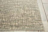 Close up of Nourison Starlight Sea Mist rug. Modern design with a grid pattern in sea mist and cream. Luxcelle material.