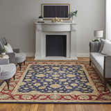 Living room scene with a Feizy Wagner blue, red, and gold traditional rug, fireplace, and gray seating. Roomscene-Rectangle