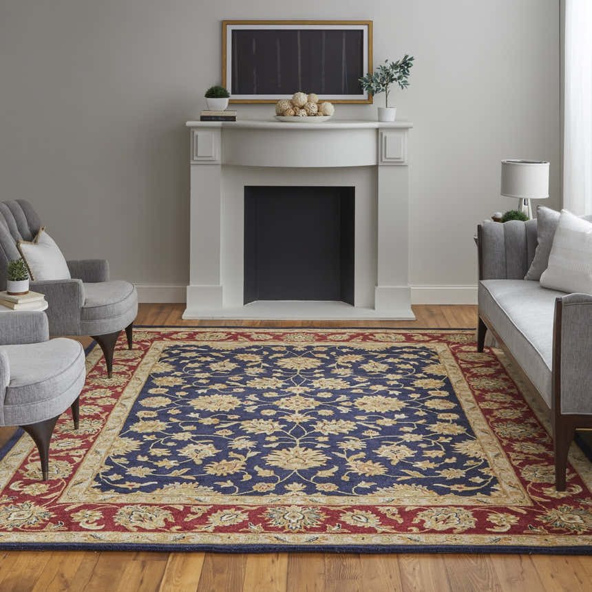 Living room scene with a Feizy Wagner blue, red, and gold traditional rug, fireplace, and gray seating. Roomscene-Rectangle