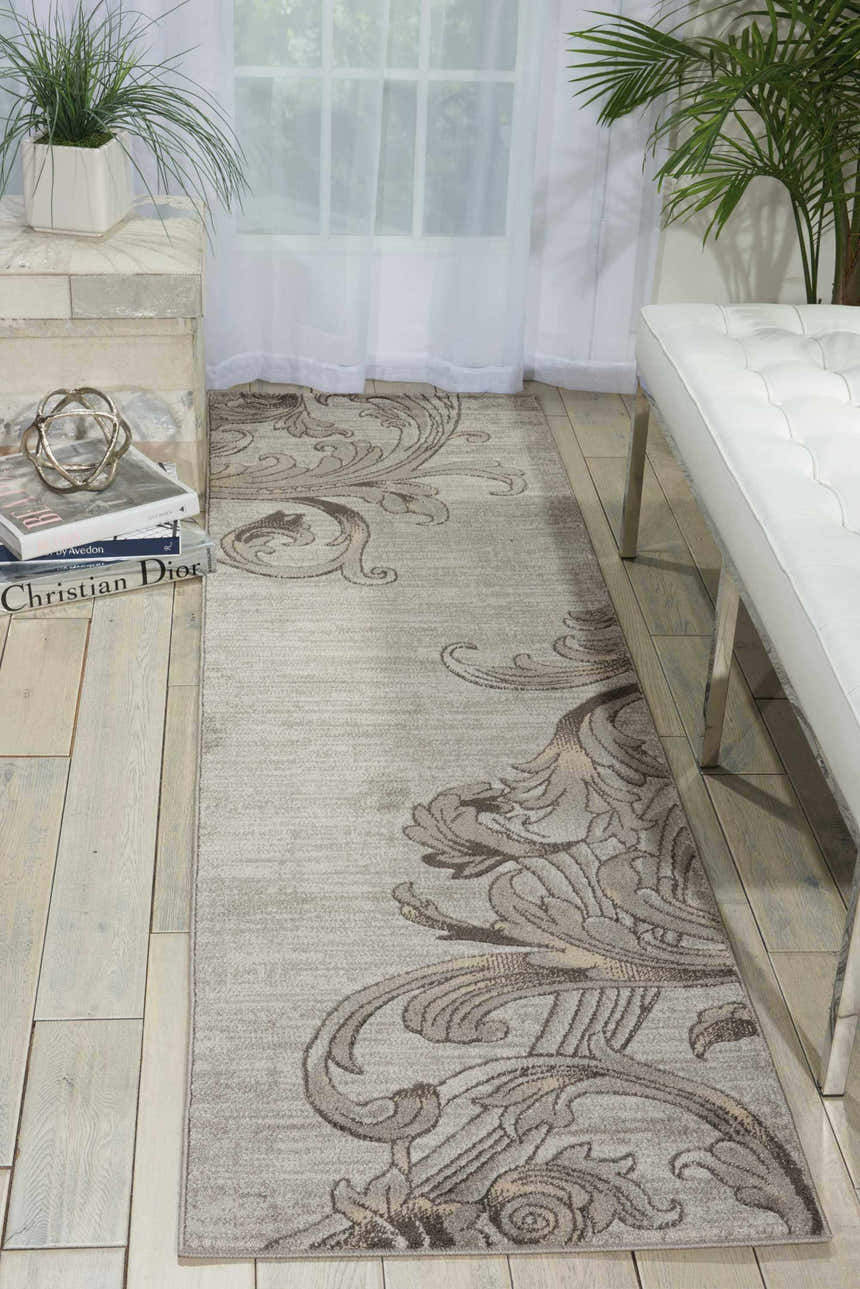 Entryway with a Nourison Maxell Graphite rug runner, white bench, and light wood floors.