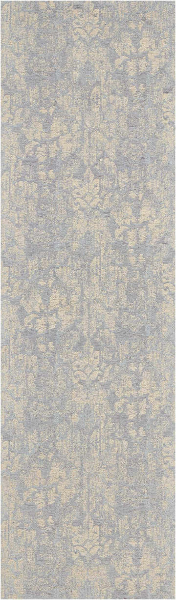 Close-up of Waverly Vintage Lux Mist rug. Blue and beige mid-century modern design with a subtle, distressed pattern.