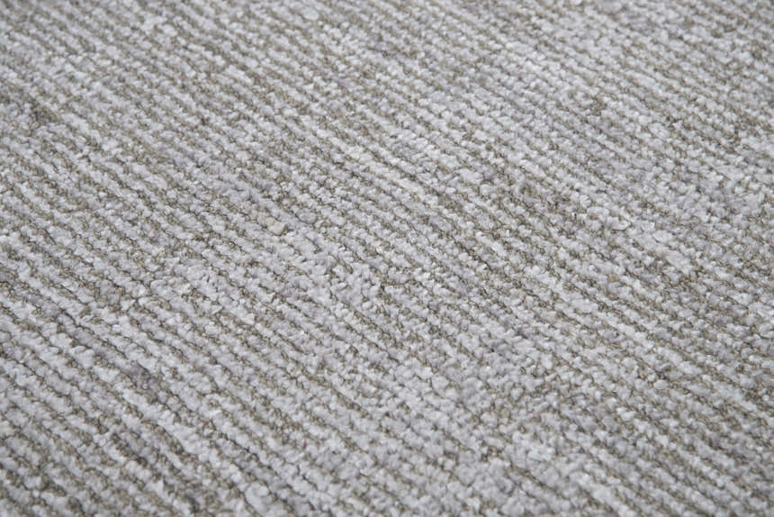 Close-up of the Rizzy GH718A area rug showing its beige, gray, and ivory tones and hand-loomed texture. Texture
