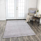 Farmhouse style room with Rizzy GH718A rug in beige and gray, chair, side table, and white french doors. Roomscene-Rectangle