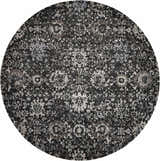 Close-up of round Nourison Twilight Onyx Persian rug. Black, gray, and ivory tones create a distressed floral pattern.
