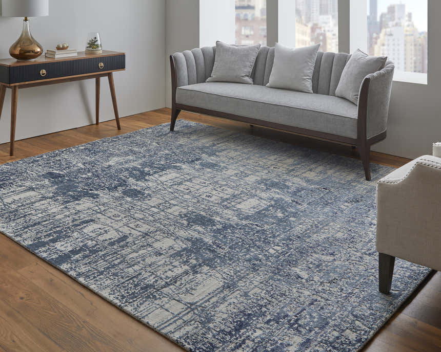 Living room with gray sofa and Feizy Eastfield rug in blue and ivory, showcasing a modern, abstract design. Roomscene-Rectangle