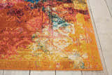 Close-up of the Nourison Celestial Seaglass rug. Features an abstract design in seaglass, orange, yellow, pink, and white hues.