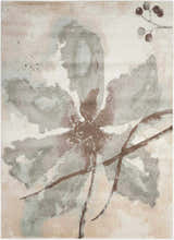 Close-up of the Nourison Euphoria Ivory rug with a chestnut brown floral design on a cream and blush background.