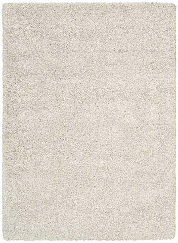 Close-up of the plush, beige Nourison Amore Bone Shag rug. Soft, textured shag design. Rectangle shape.