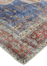 Close-up of the Feizy Percy Transitional Medallion Area Rug in red, tan, and blue. Features a detailed, distressed medallion pattern. Corner