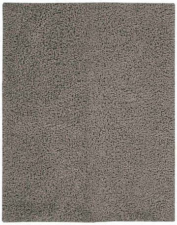 Close-up of the plush texture of the grey Nourison Zen Shag rug. Handmade polyester shag rug.