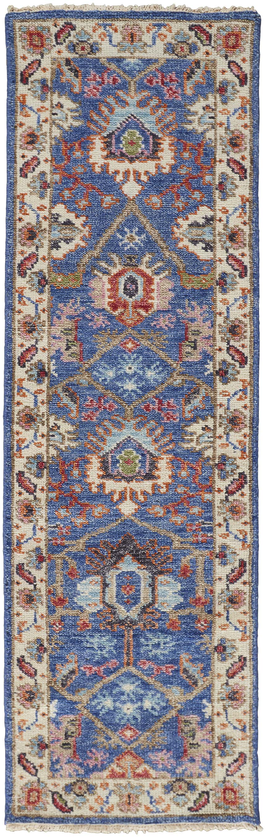 Close-up of the Feizy Beall Traditional Oriental rug in blue and red. Hand-knotted wool runner with farmhouse style design. Design-Runner