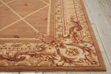 Close-up of Nourison Ashton House Cocoa rug showing camel, tan, and red floral vintage pattern and geometric center.