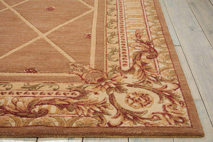 Close-up of Nourison Ashton House Cocoa rug showing camel, tan, and red floral vintage pattern and geometric center.