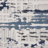 Close-up of the Nourison Urban Decor Ivory/Slate rug, featuring a modern abstract design with blue and gray accents.