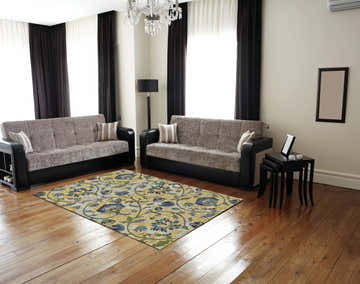 Living room scene with sofas and Feizy Brixton Modern Scroll ivory, gold, and green area rug on wood floor. Roomscene-Rectangle