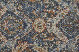 Close-up of the Feizy Kaia rug. Transitional floral design in blue, orange, and ivory. Soft texture. Texture