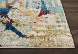 Close-up of Nourison Fusion Cream Multicolor rug showing abstract pattern, cream base, and accents of blue, gold, and red.