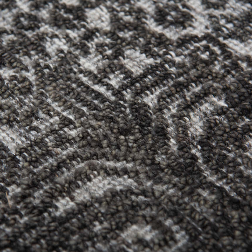 Close-up of the hand-knotted Rizzy HTN720 area rug. Gray and ivory wool with a traditional farmhouse pattern. Texture