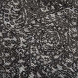 Close-up of the hand-knotted Rizzy HTN720 area rug. Gray and ivory wool with a traditional, farmhouse-style pattern. Texture