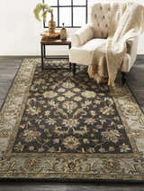 Living room scene with Feizy Eaton Traditional Oriental Rug in blue, gray, and taupe. Tufted chair and wood side table. Roomscene-Rectangle