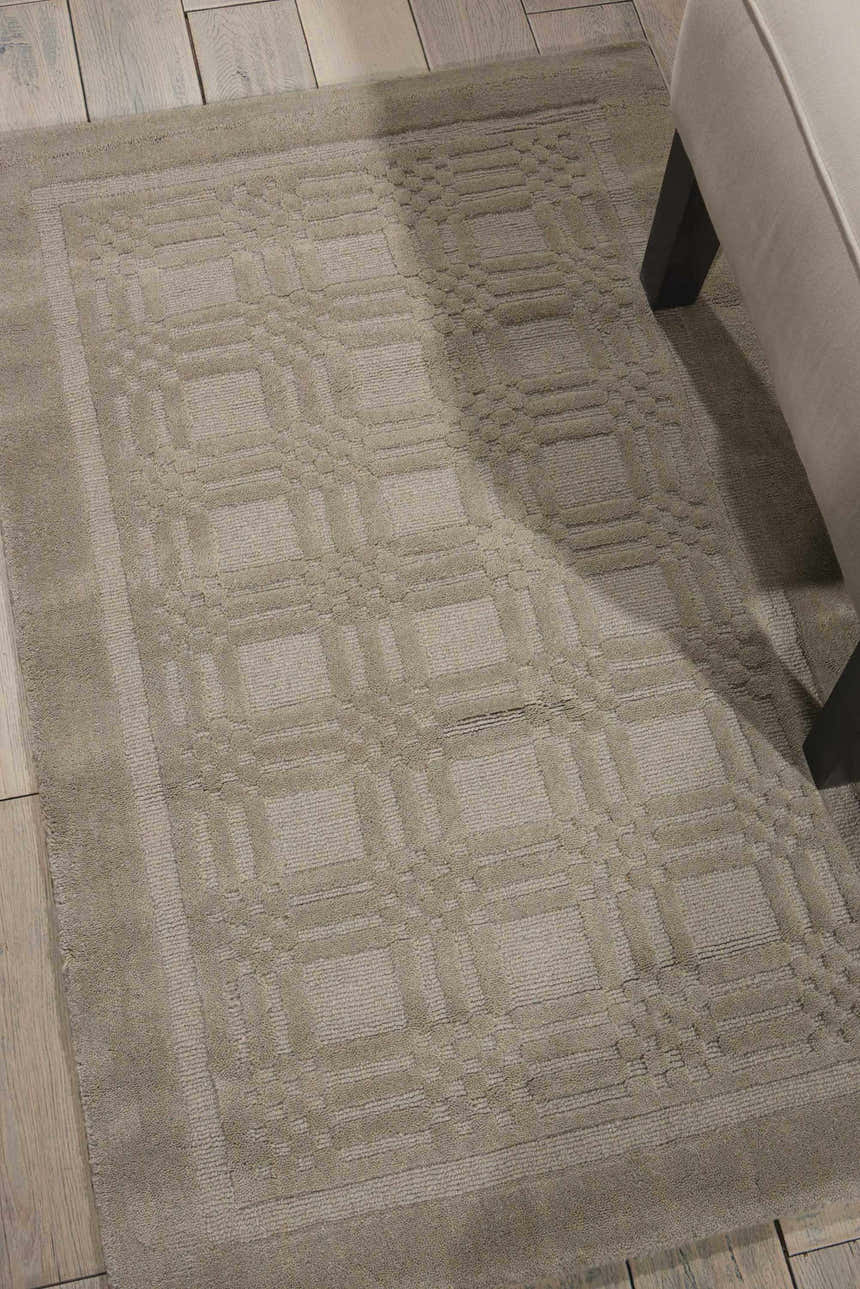 Close-up of the handmade Nourison Westport Grey rug, featuring a subtle geometric pattern and soft wool texture.