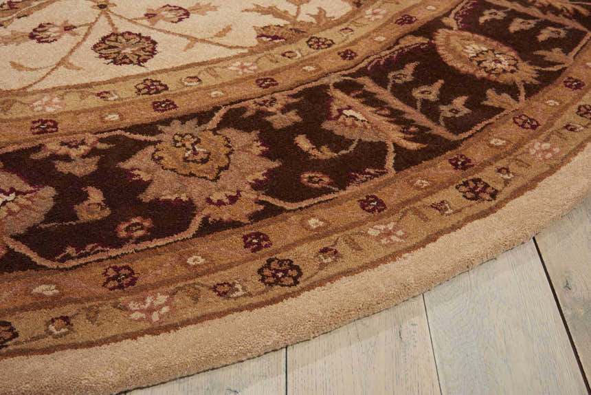 Close up of the beige Nourison Heritage Hall Persian rug, featuring floral patterns and a soft, textured surface.