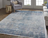Living room scene with a Feizy Cadiz rug in blue, gray, and silver under a gray chair and light sofa. Roomscene-Rectangle