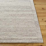 Close-up of the Blenda Beige Area Rug showing its wool texture, subtle stripes, and neutral color palette. Front