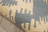 Close up of the Barclay Butera Prism Slate rug showing taupe and slate geometric pattern and wool texture.