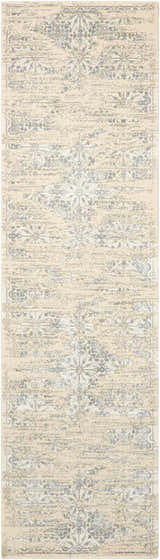 Close-up of Nourison Luminance Bone Vintage rug. Beige rug with distressed blue floral and geometric pattern. Handmade.