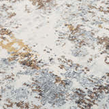 Close-up of the Rizzy JAS732 area rug. Abstract design in beige, black, blue, dark red, and ivory. Machine woven texture. Texture