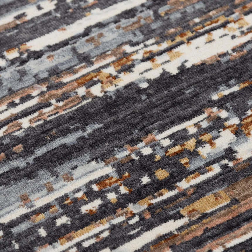 Close-up of the Rizzy JAS734 area rug. Abstract design in beige, dark red, gray, ivory, and rust. Machine woven texture. Texture