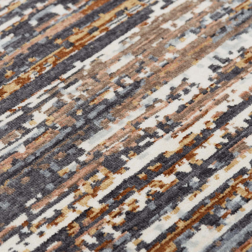 Close-up of Rizzy JAS734 area rug. Abstract design in beige, dark red, gray, ivory, and rust. Machine woven texture. Texture