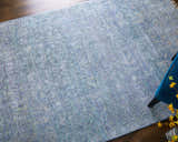 Close-up of the Feizy Caldwell Transitional Distressed Area Rug in blue and gray with a textured, hand-woven design. Roomscene-Rectangle