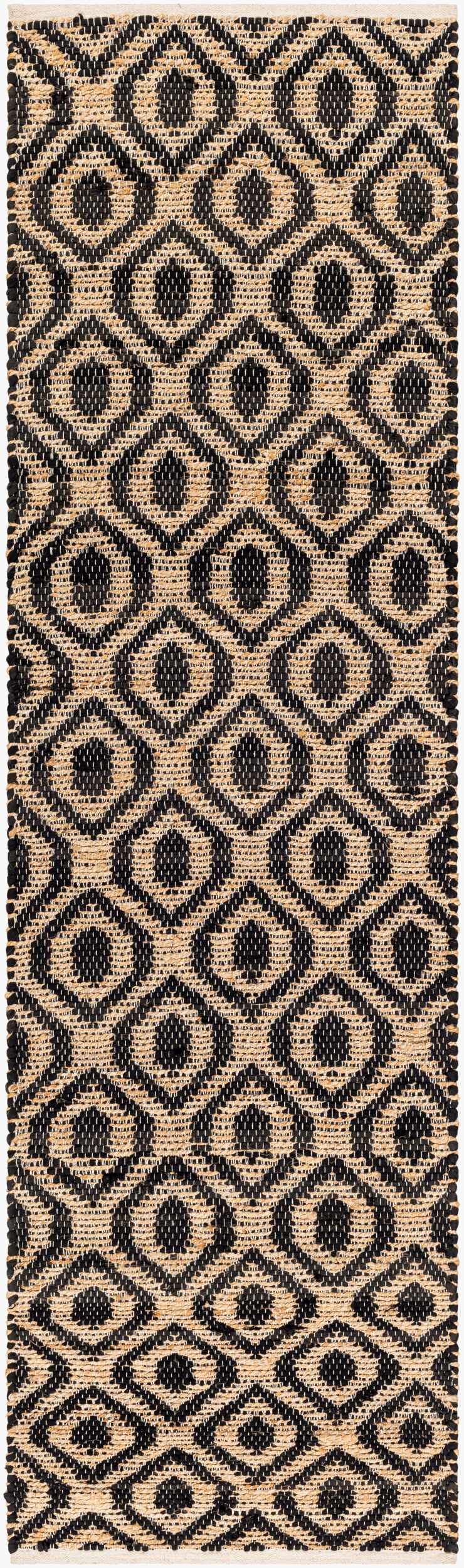 Close-up of the Isaye Charcoal Area Rug. Hand-woven jute and recycled fabric with a geometric diamond pattern in dark beige and black. Design-Runner-268