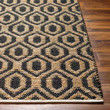 Close-up of the Isaye Charcoal Area Rug showing the jute and recycled fabric geometric pattern and texture. Front