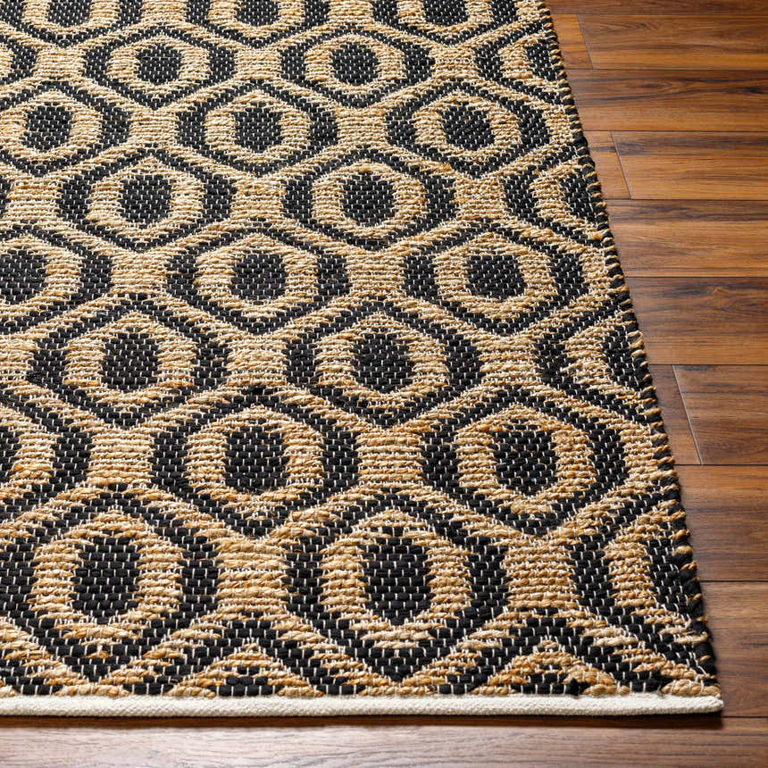 Close-up of the Isaye Charcoal Area Rug showing the jute and recycled fabric geometric pattern and texture. Front