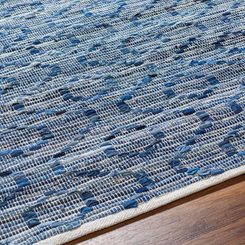 Close-up of the hand-woven Gurit Blue & Brown Area Rug showing its recycled fabric texture and contemporary design. Texture