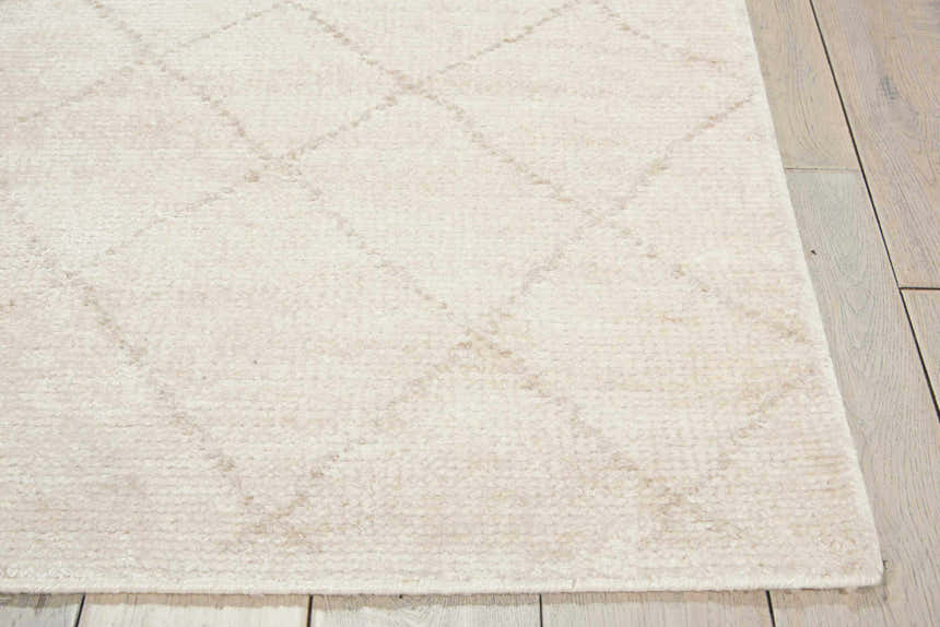 Close-up of the Calvin Klein Home Heath Tusk rug. Handmade rayon rug with a subtle diamond pattern.