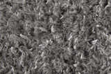 Close-up of the plush texture of the gray Feizy Darian Modern Solid Area Rug. Texture